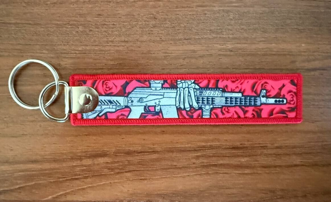 Double-Sided Keychain with Rifle and Roses Design by Korps Vyshivaniya