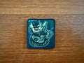 The Russian Cartoon-Style Soldier Design Patch – Military Badge by Tanki Store features a cartoon soldier in camo with a rifle on a blue background. Ideal for collectors or bulk orders seeking the best price.