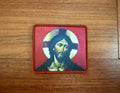Patch with a religious design on a wooden surface