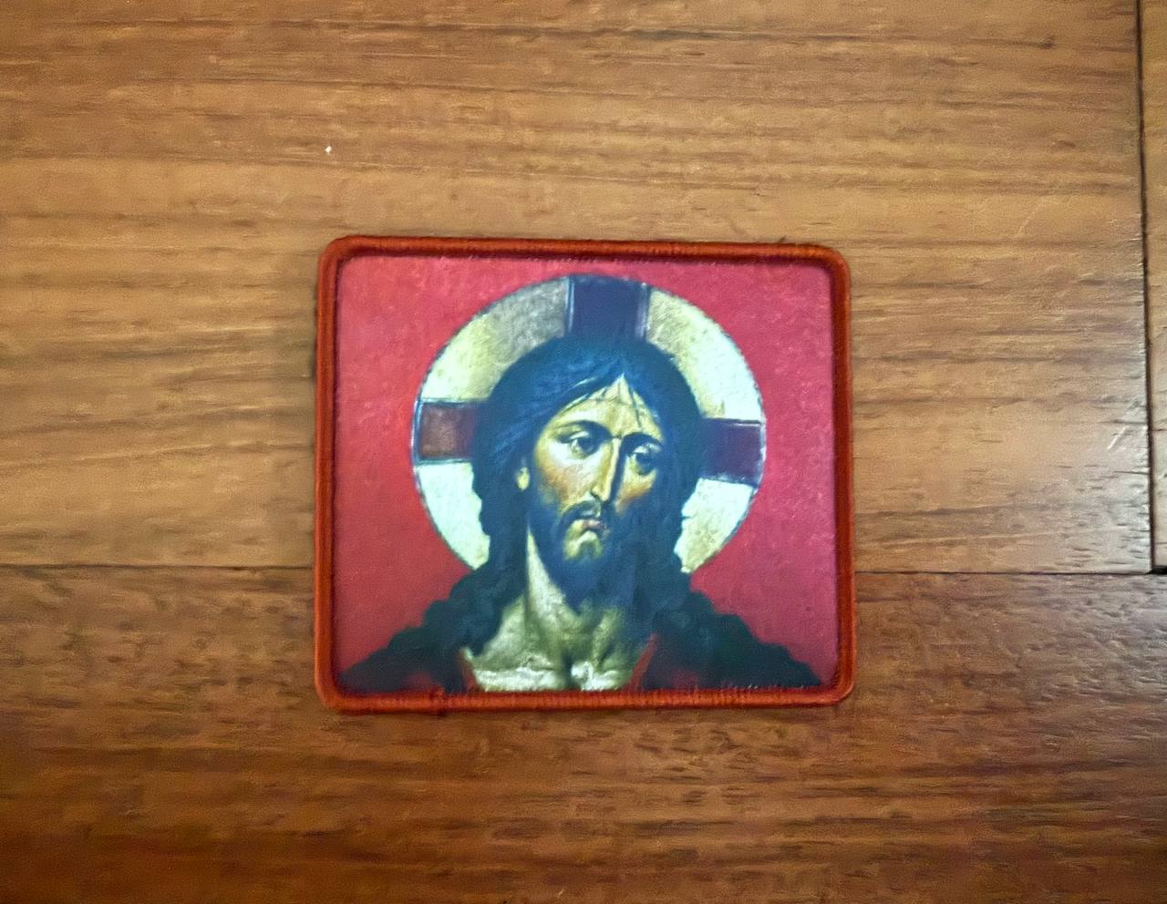 Patch with a religious design on a wooden surface