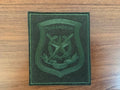 Russian 2nd Guards Motorized Rifle "Tamanskaya" Division VKBO Military Patch in dark green fabric with embroidered emblem and Cyrillic text on a wooden surface.
