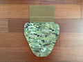 Russian Wartech - TV-130 "Conus" Groin Protector Pad – Multicam displayed on a wooden surface, featuring a camouflage pattern and adjustable Velcro strap.