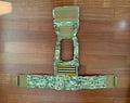 Russian Wartech - TV-124 Vest – Multicam - Size S/M tactical vest laid flat on wooden floor, featuring camouflage pattern and webbing for modular attachments.