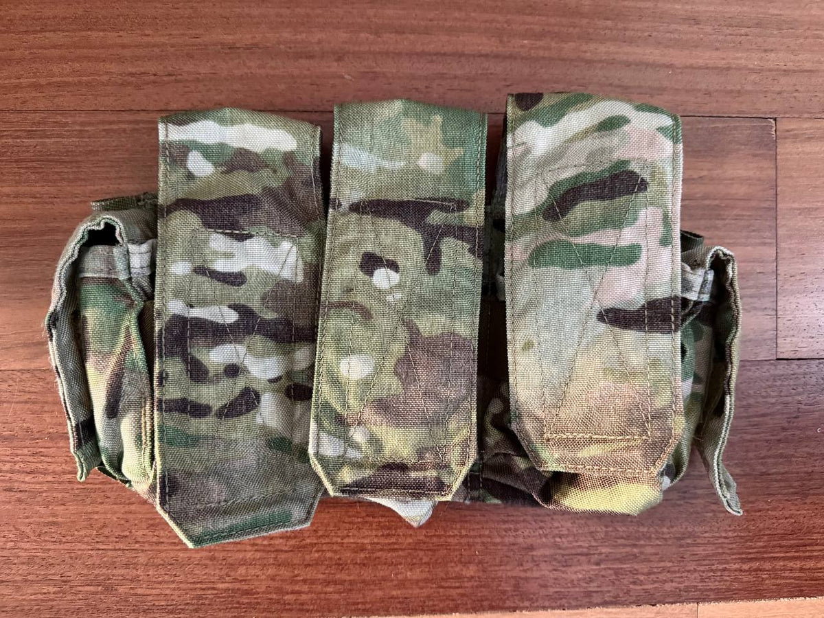 Eighty-Four - Triple Rifle Mag Placard from Kommandostore – Multicam - USED laid flat on wooden surface, showing three camouflaged fabric magazine pouches with flap covers.