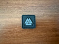 Russian Valknut Slavic/Norse Symbol 1x1' - Military Patch featuring interlocking triangular design on a black square background displayed on wooden surface.