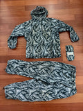Russian NPO-SM "Sklon" Water-resistant/Windproof Suit – Melted Snow Color laid flat on a wooden floor, showing jacket with hood, pants, and matching compact pouch, featuring Russian surplus camouflage pattern.