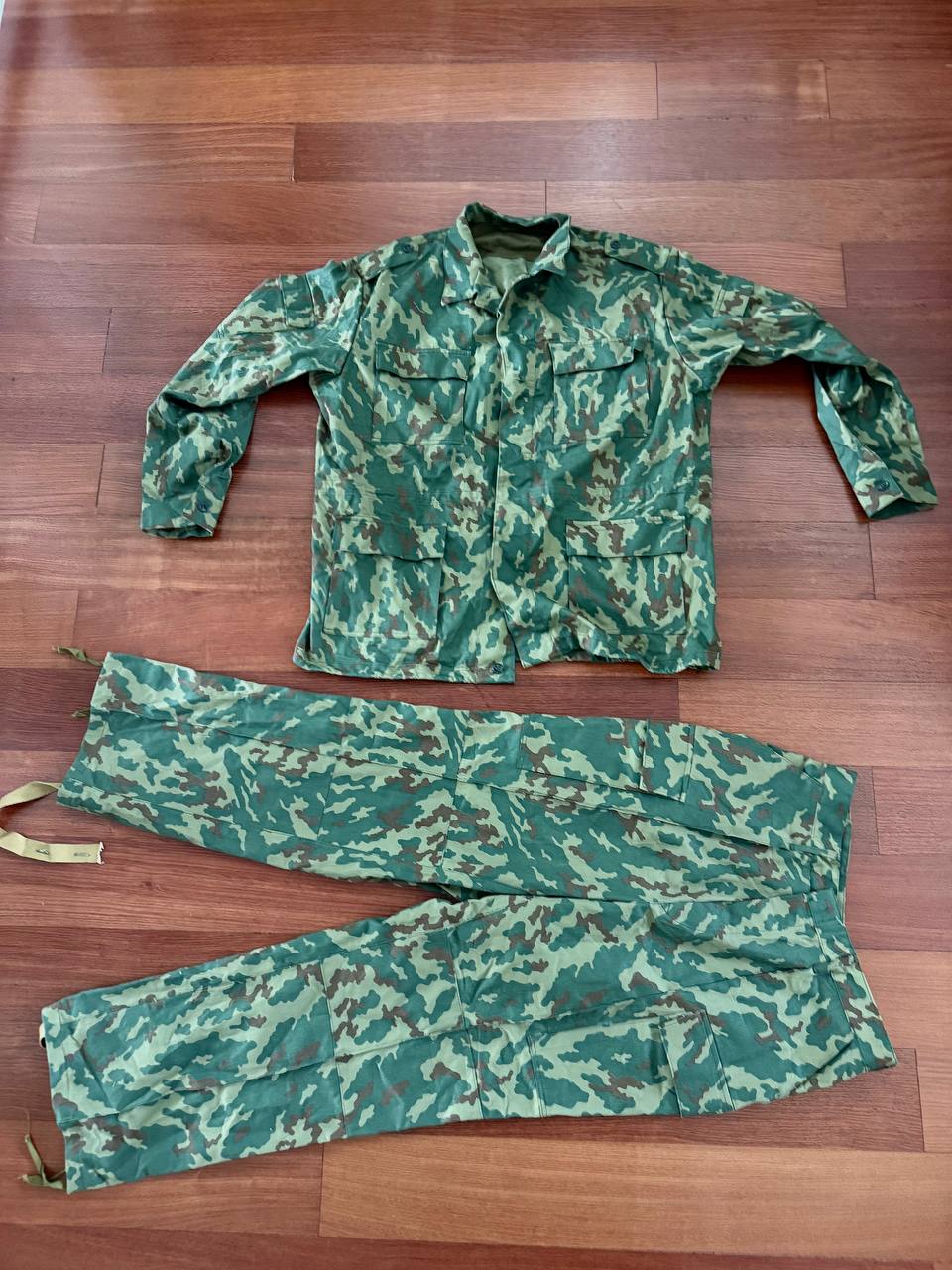 Russian Army "VSR-93" Summer Suit - Size 58-5 displayed flat on a wooden floor, featuring green and brown camouflage pattern typical of Russian surplus military gear.
