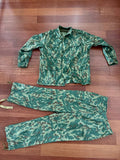 Russian Army "VSR-93" Summer Suit - Size 58-5 displayed flat on a wooden floor, featuring green and brown camouflage pattern typical of Russian surplus military gear.
