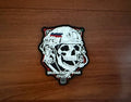 Russian "Evacuation Group" Tactical PVC - Military Patch featuring a skull wearing a tactical helmet with Russian text, presented on a wooden surface.