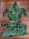 Russian Partizan Sever Camouflage Suit - Size 56-6 displayed on wooden floor, featuring green digital camouflage hoodie and pants with elastic cuffs designed for outdoor and tactical use.