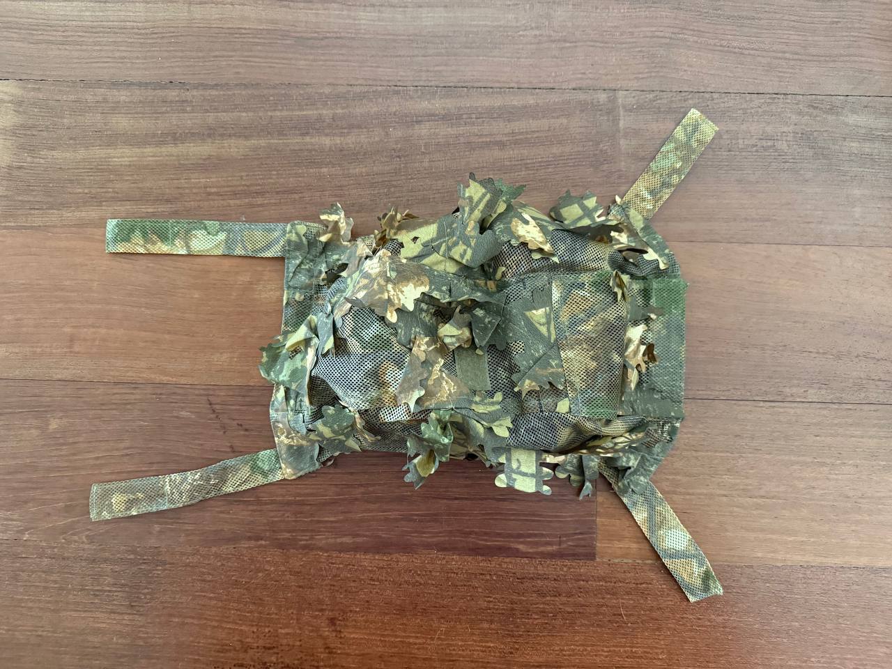 Russian Sokl "Autumn" Ops-Core Leaf Helmet Cover - Universal Size displayed on wooden surface, featuring realistic leaf camouflage pattern for Russian surplus tactical use.