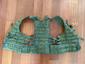 Russian 6Sh117 Tactical Vest Old Gen - EMR Digital Flora laid flat on a wooden surface, showcasing its tactical strap system and durable Russian surplus design.