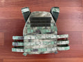 Russian Wartech TV-110 Vest - A-TACS FG Camo - Pre-War Production laid flat on a wooden surface, showing its camouflage pattern and adjustable straps.