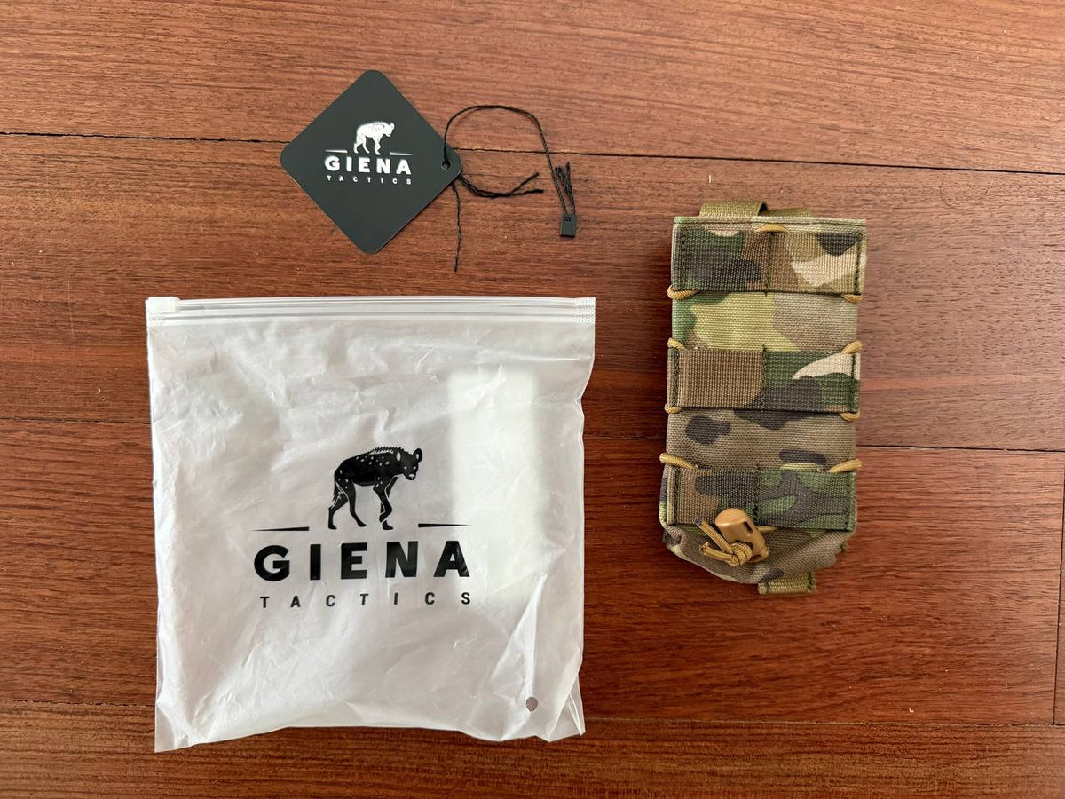Russian Giena Tactics Open Top Single Mag Pouch - Multicam displayed on a wooden surface alongside branded packaging and tag.