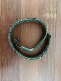 Russian Ars Arma Ronin Tactical Belt - EMR - L in green camo pattern, laid flat on wooden surface, showcasing durable fabric and buckle closure.
