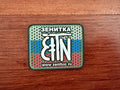 Russian Zenitco with Tricolor Badge - Military Patch featuring a stylized rifle graphic and Russian text over a green, blue, and red honeycomb background.