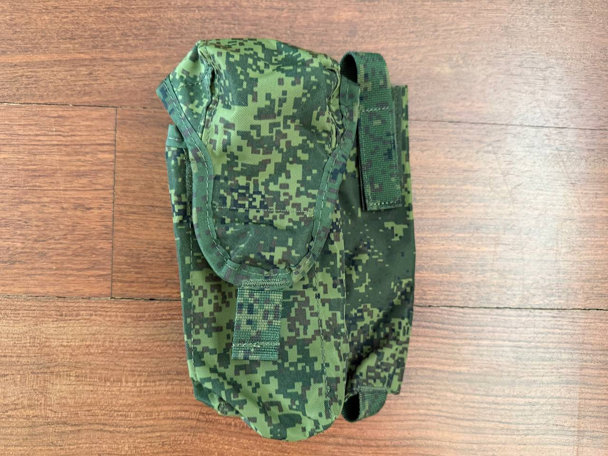 Russian Triada-Tko Left-Handed AK Dual Maga Pouch with ROP Flare Pouch - EMR in green digital camouflage pattern placed on a wooden surface, showcasing durable fabric and secure fastening.