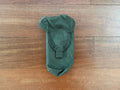 Russian Tekhinkom AK Mag Pouch (2CELL) - Olive Drab, a durable Russian surplus pouch designed to securely hold two AK magazines, displayed on a wooden surface.