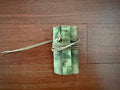 Compact tactical cover in ATACS FG pattern with securing cord, designed for sound suppressors, showing the Russian Suppressor Cover for Tactical Silencers - 14cm Length - ATACS FG.