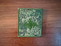 Russian EMR - Military Patch featuring a digital camouflage pattern with an embroidered emblem and Russian text, displayed on a wooden surface.