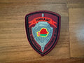 Belarus Spetsnaz "Tornado" Special Forces - Military Patch featuring a sword behind a shield with a red outline of Belarus on a maroon and black background.