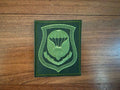 Green embroidered patch featuring a parachute, wings, and insignia on a dark background, representing the Russian 7th Guards Air Assault Division - Field Military Patch.
