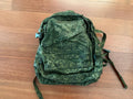 Russian Tehkinkom Big Assault Backpack - EMR Digital Flora camouflage pattern tactical military backpack laid flat on wooden floor surface.