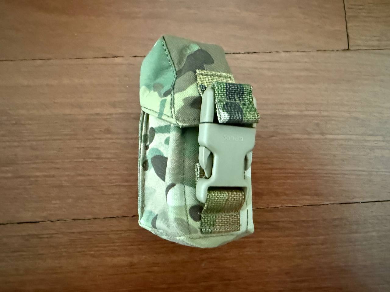Compact tactical pouch in Multicam pattern with secure buckle closure designed for outdoor use, identified as Russian Gear Craft MK5 Grenade Pouch - Multicam.