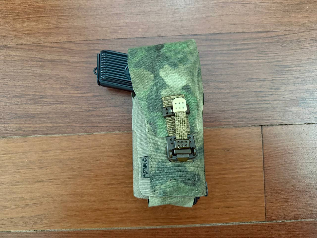 Russian Gear Craft Universal Tactical Holster - A-TACS FG camouflage tactical holster holding a black magazine, designed for versatile military and outdoor use.