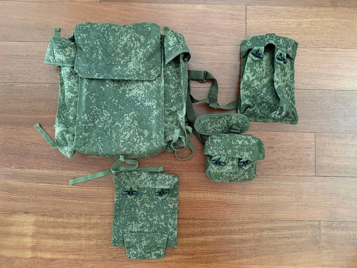 Russian Army RD-54 VDV Airborne Paratrooper Backpack - EMR Digital Flora with multiple matching detachable pouches laid out on a wooden floor, featuring a digital camouflage pattern.