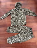 Russian Sokl Leshy 4 Suit - Granite - Size 50-52/4 displayed on wooden floor, featuring textured camouflage jacket with hood and matching pants designed for outdoor use.