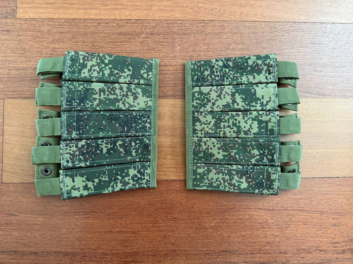Russian Triada-TKO VOG Grenade Pouches - EMR Camo displayed on wooden surface, featuring digital camouflage pattern and multiple securing straps.
