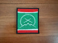 Russian Dagestan Tabasaran Flag - Military Patch featuring a green background with white crossed rifles, a circle of stars, mountain design, and red and white stripes on top and bottom edges.