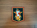 Russian "The Motherland Calls" - Military Patch featuring a figure with a raised sword in front of a red star on a black background with yellow and red border, displayed on a wooden surface.