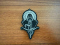 Decorative patch with a design on a wooden surface