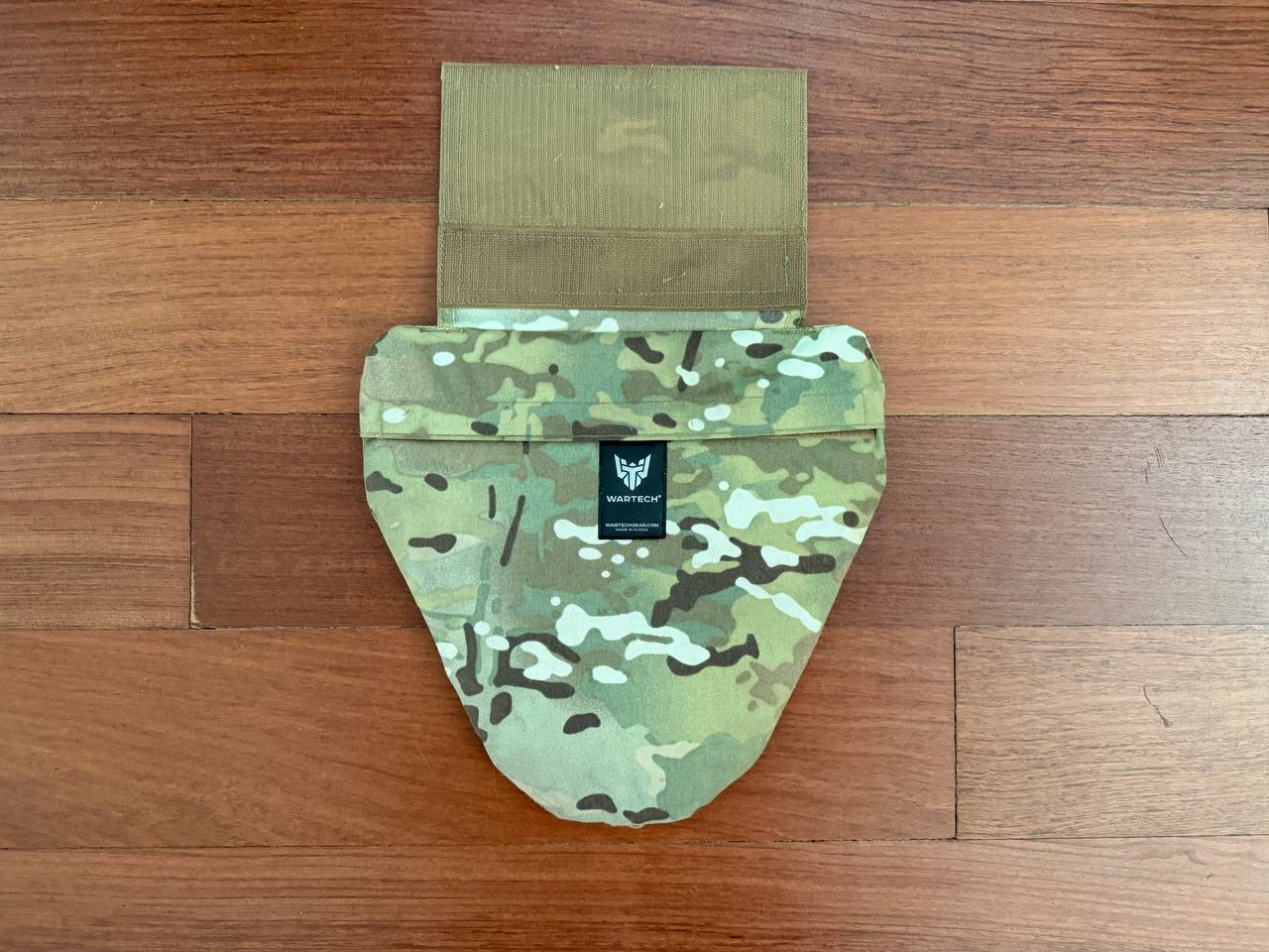 Russian Wartech - TV-130 "Conus" Groin Protector Pad – Multicam in camouflage pattern with durable fabric, displayed on a wooden surface indicating Russian surplus tactical gear.