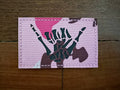Russian "Skeleton Shaka" Pink Camo - Military Patch featuring a skeleton hand in a shaka gesture on a pink camo fabric background, suitable for Russian surplus collectors.