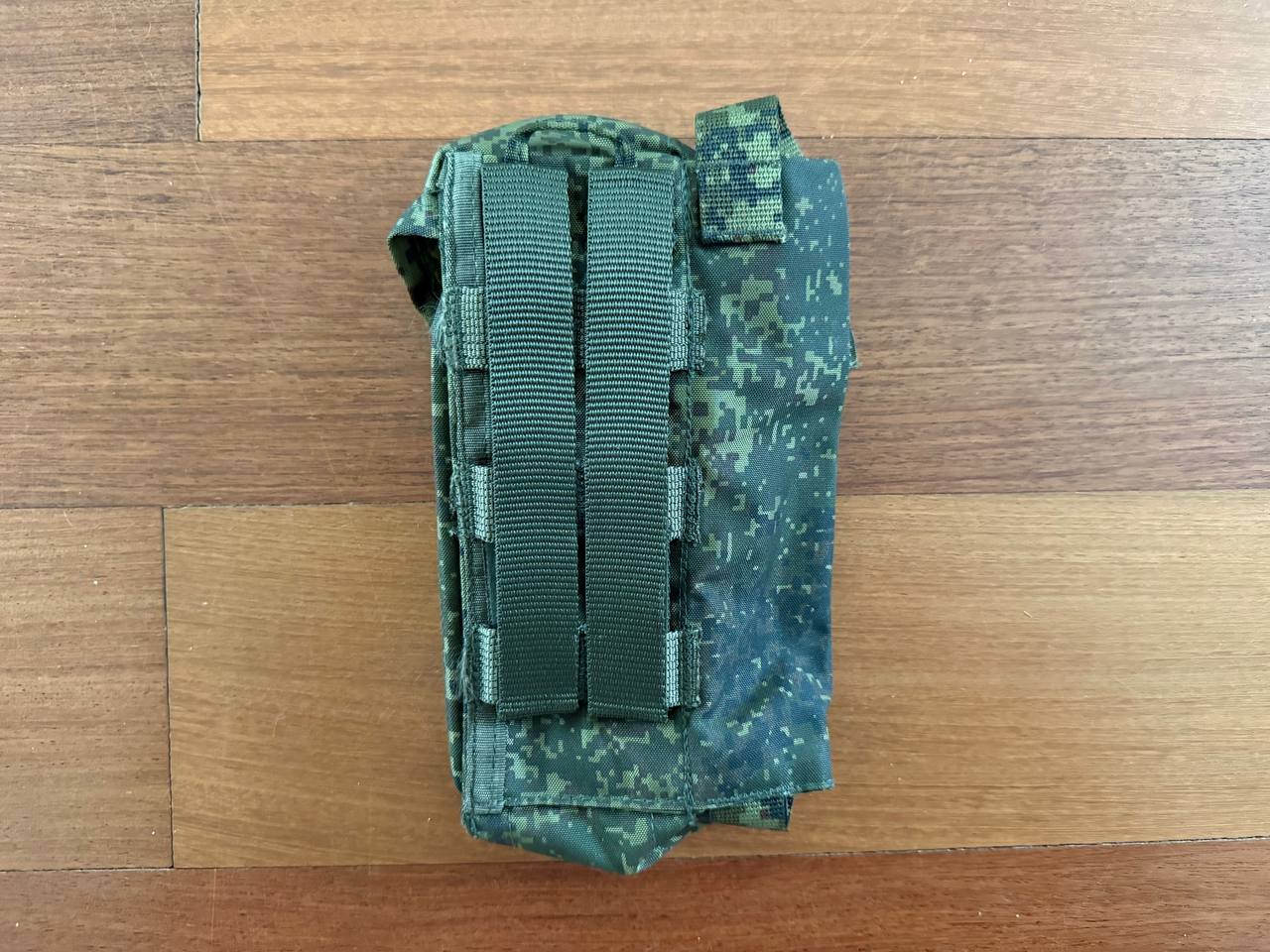 Russian Tekhinkom Right Handed Dual AK Magazine Pouch with ROP Flare Slot – EMR (New Gen) in digital camo pattern laid flat on wooden surface showing MOLLE attachment straps.