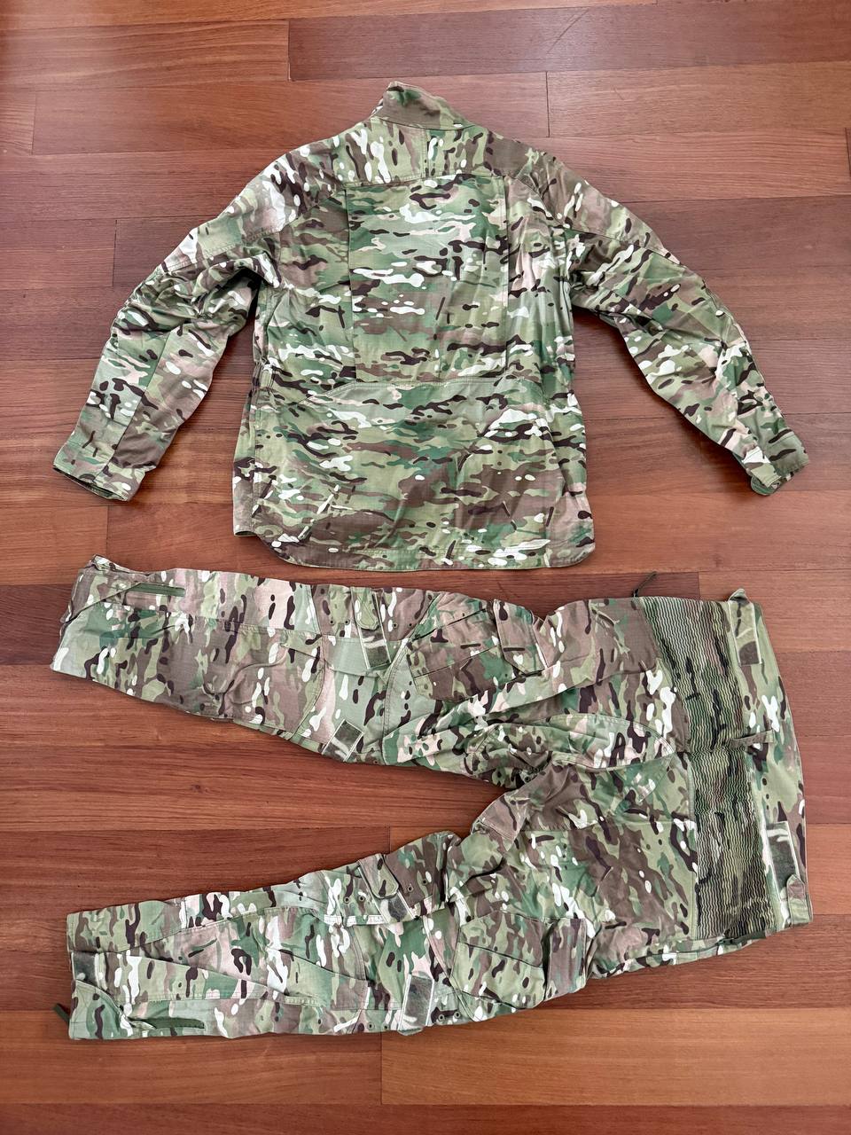 Russian Slavyanka FSB Contract Set – Multicam - Size 54/5 displayed flat on a wooden floor, showing the camouflage pattern typical of Russian surplus tactical clothing.