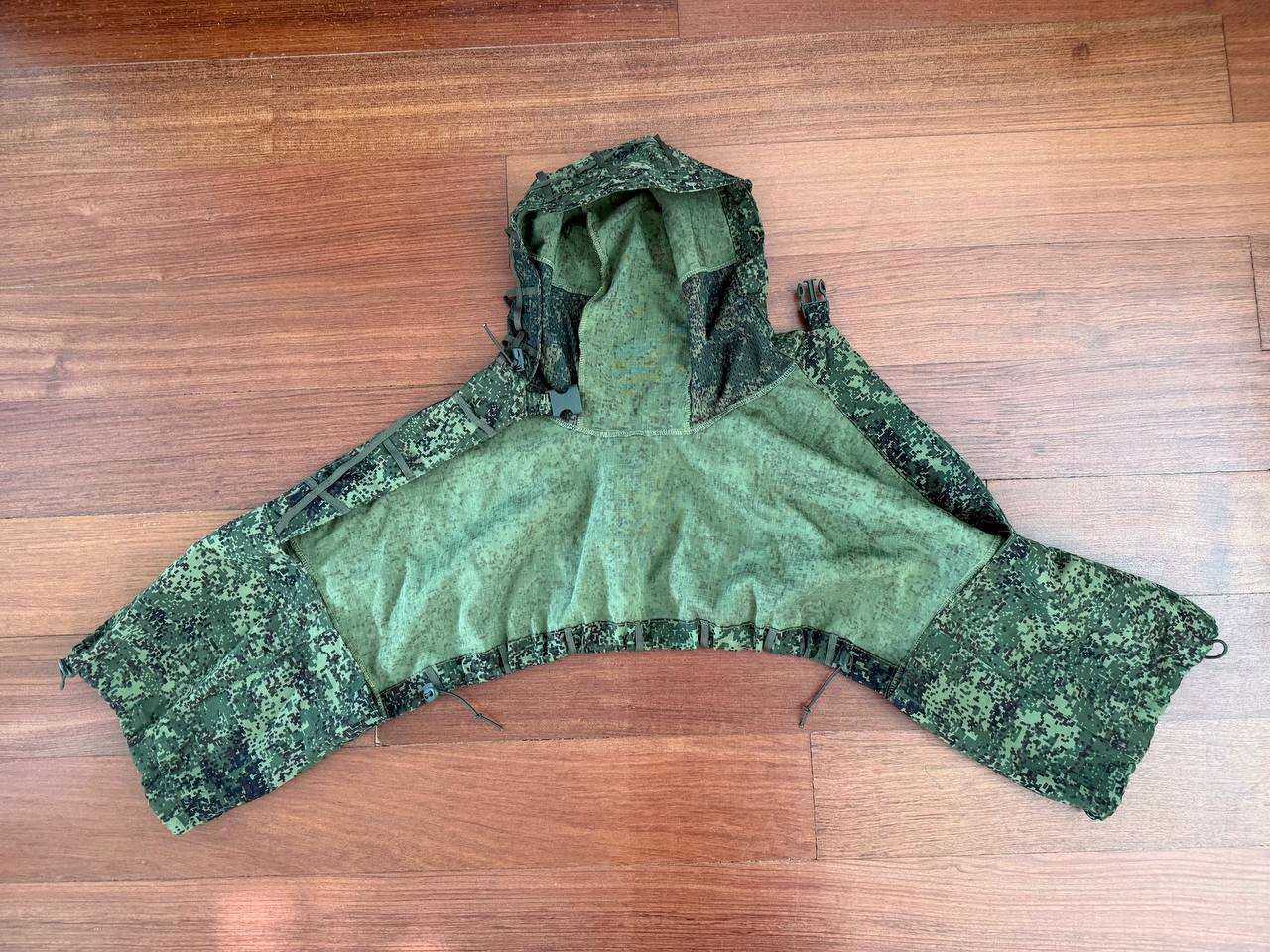 Russian Greyshop Sniper Concealment Cape – EMR (Digital Flora) displayed flat on a wooden floor, showcasing the green digital flora camouflage pattern typical of Russian surplus gear.