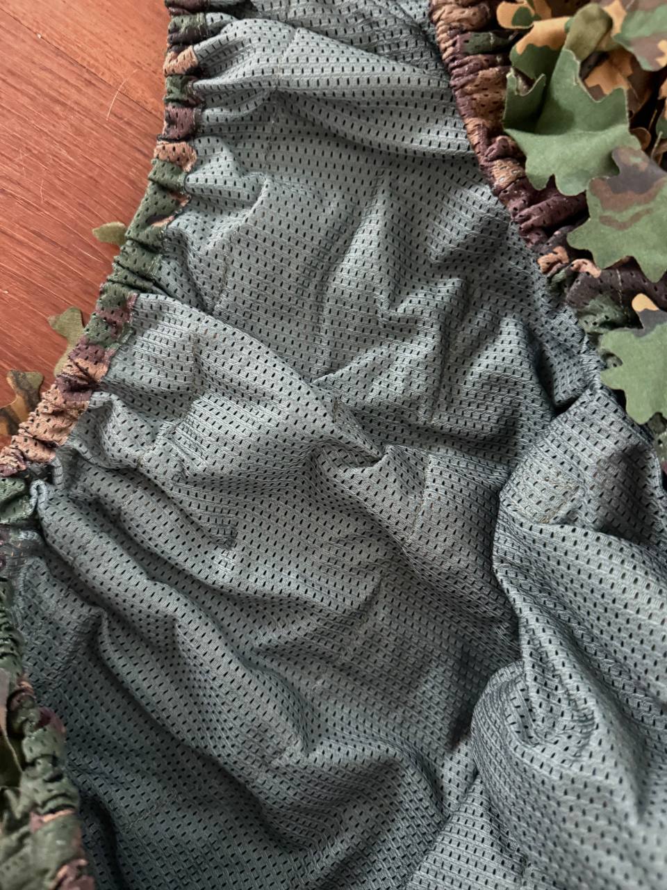 Close-up of breathable mesh interior lining and elastic edges of a Russian SS-Leto Backpack Cover (40–60L) in camouflage, highlighting quality and durable construction from Russian surplus.