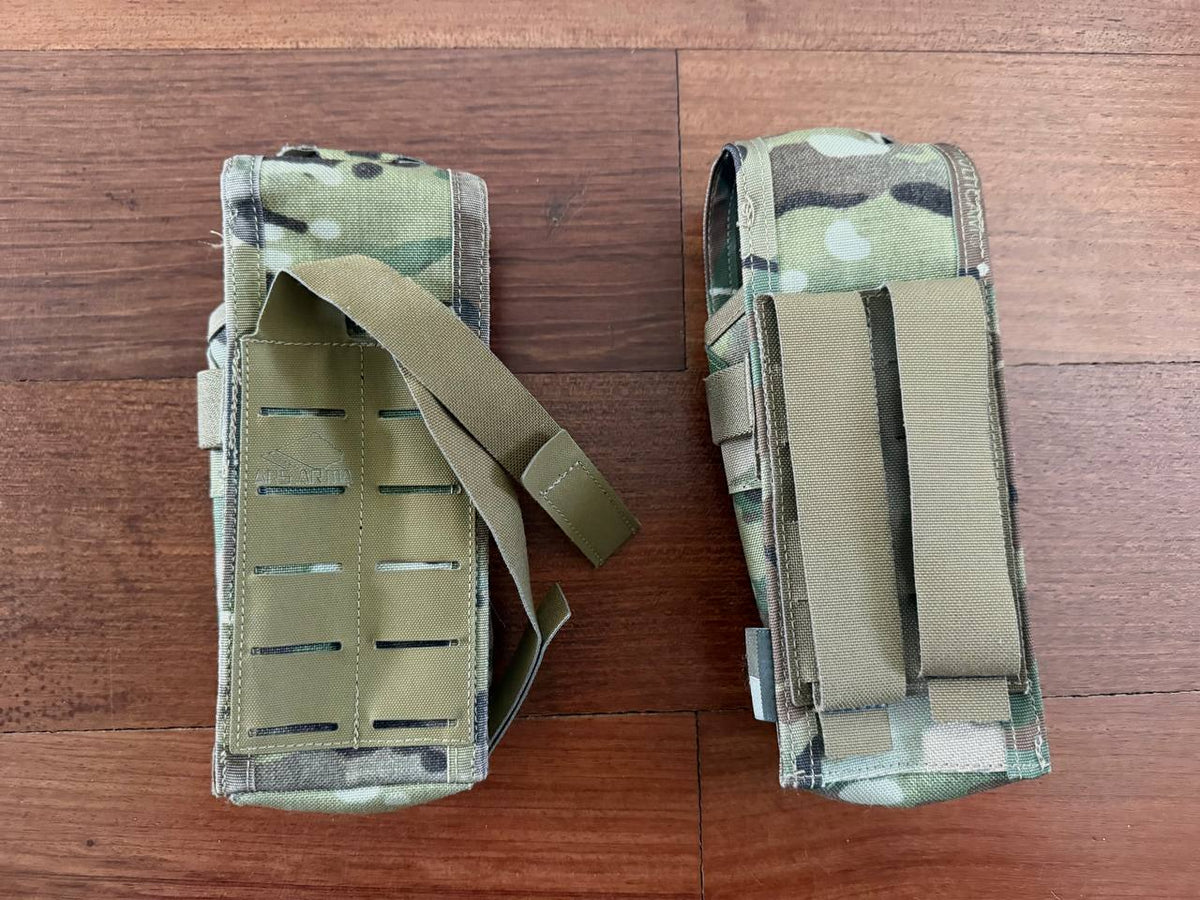 Russian Ars Arma Set of 2 Mag Pouches – Multicam (Used) displayed on a wooden surface, featuring camouflage pattern and adjustable straps, suitable for Russian surplus gear.