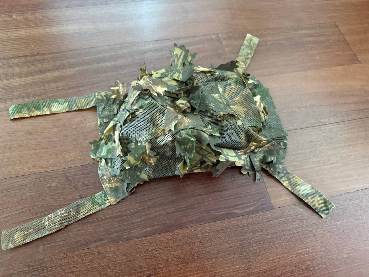 Russian Sokl "Autumn" Ops-Core Leaf Helmet Cover - Universal Size displayed on a wooden surface with detailed mesh and autumn camouflage pattern.