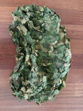 Russian Sokl Leaf Backpack Cover (60L) - Olja Pattern shown in green and beige camouflage with leaf-like fabric overlays designed for outdoor concealment in wooded environments.