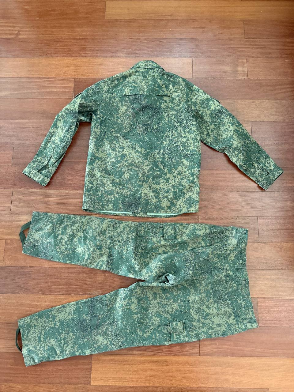 (USED) Russian 4 Layer Summer Suit - EMR Digital Flora - Size 54/5 laid flat on a wooden floor, featuring a green digital camouflage pattern typical of Russian surplus military gear.