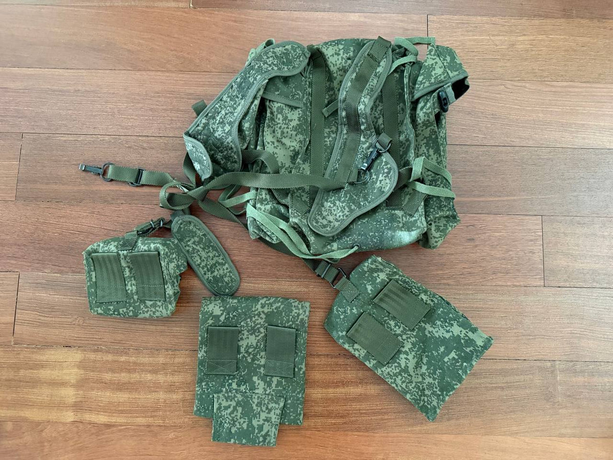 Russian Army RD-54 VDV Airborne Paratrooper Backpack - EMR Digital Flora with matching pouches laid out on a wooden floor, showcasing military green digital camouflage pattern.