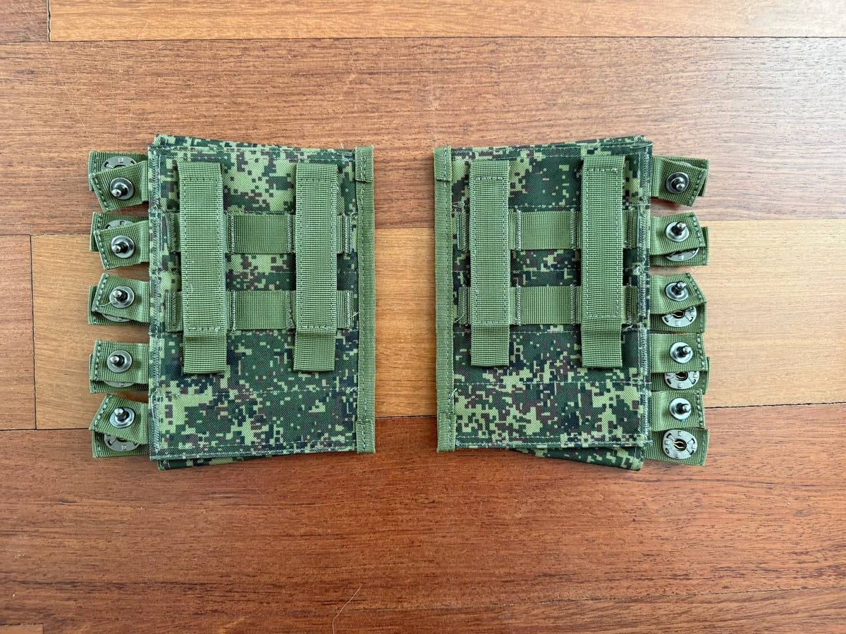 Pair of Russian Triada-TKO VOG Grenade Pouches - EMR Camo with snap fasteners and straps on wooden surface, showing green digital camouflage and sturdy construction.
