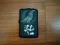Russian Memento Mori Raven and Skull - Military Patch featuring a black raven perched on a skull, designed in dark muted tones on a wooden surface background.