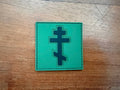 Russian Orthodox Cross PVC Olive/Black - Military Patch with a black Russian Orthodox cross design on an olive green background, suitable for tactical gear or uniforms.