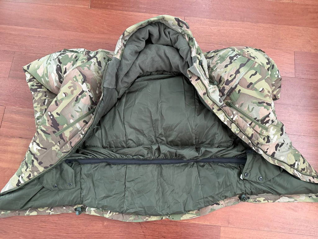 Open Russian Innovation Cold Weather Jacket (Layer 7) – Multicam - Size 54/5 showing the insulated interior and camouflage outer fabric on a wooden surface.